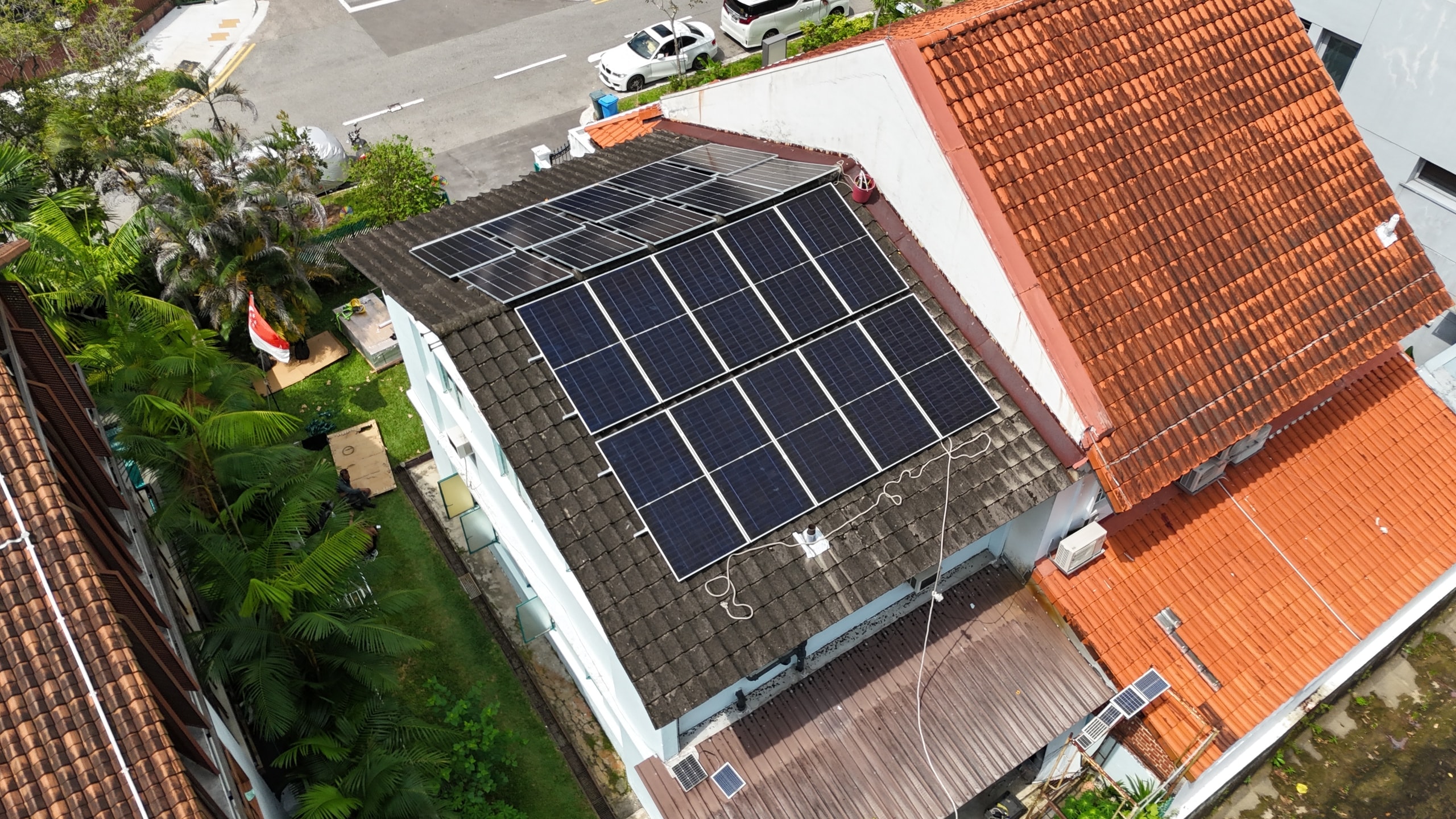 Drone view of the Bukit Timah house and its garden, panels on the main roof